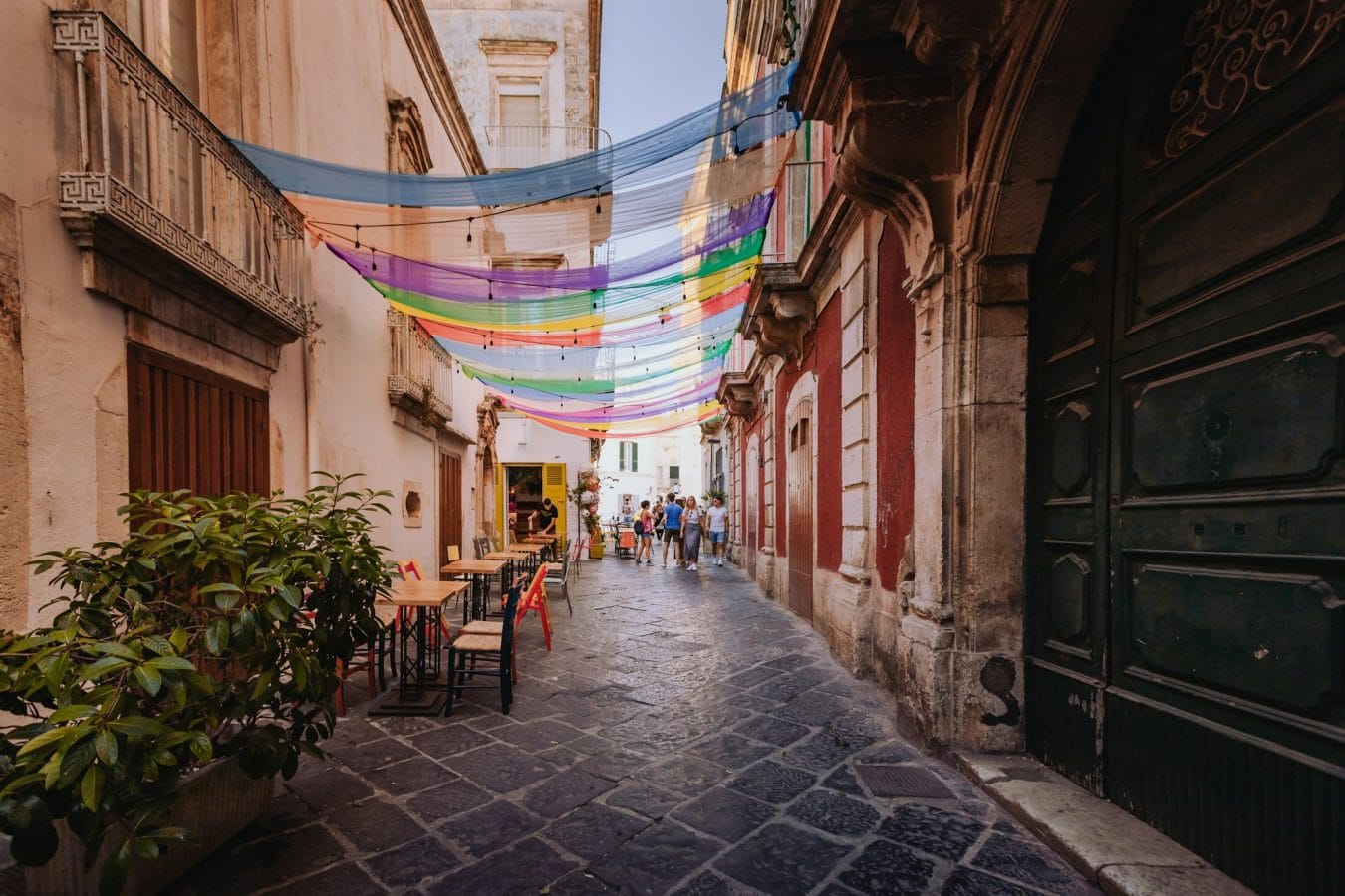 Alley in the historic center of Martina Franca with colored awnings